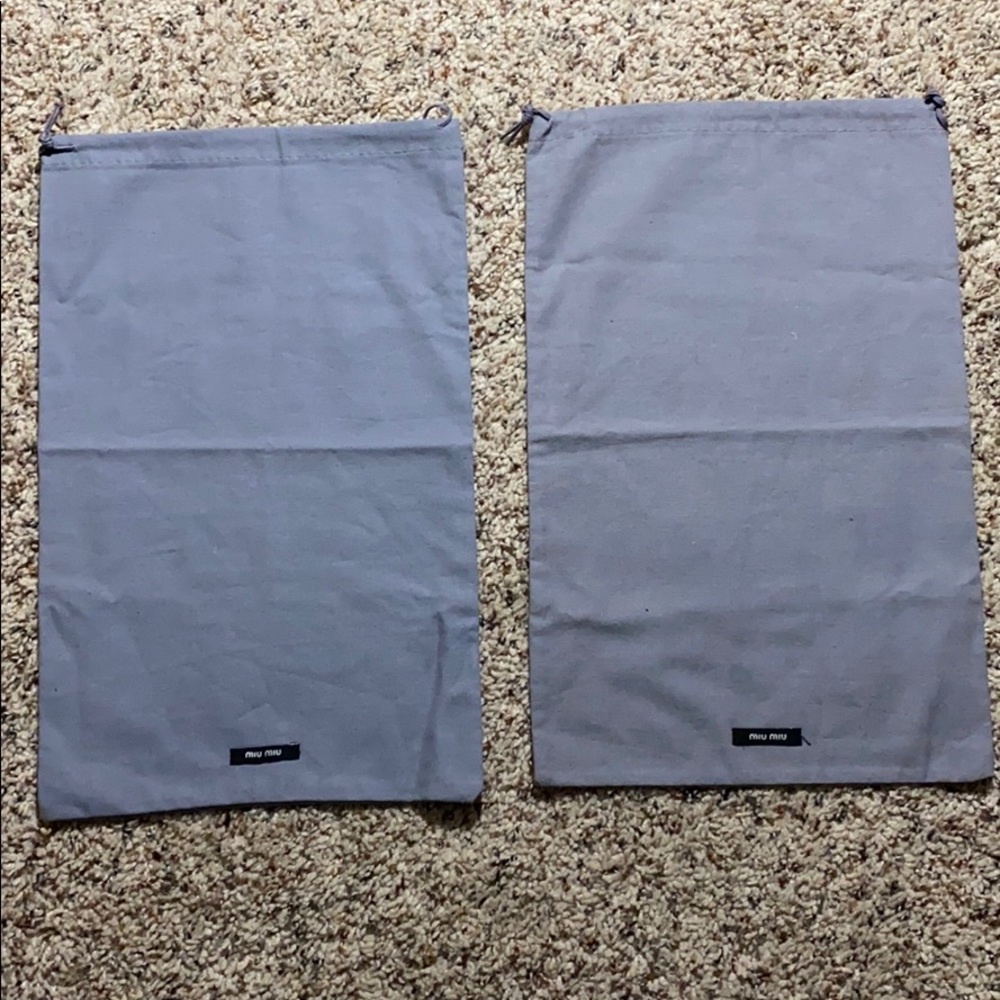 2 Miu Miu dustbag shoe covers